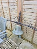 A vintage very large bell and an arch mount