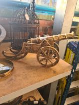 A model brass Cannon with decorative wheels