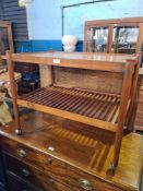 A 1960s/70s teak tea trolley having sliding tray with slatted undertier, possibly Danish, retailed f
