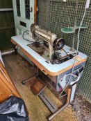An industrial Singer sewing machine on work table base H211, V866 A61