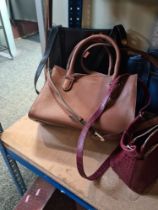A quantity of modern ladies handbags to include Osprey and a Paul Costelloe example