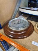Selection of nautical theme collectables including model wooden boat, barometer and leaping brass fi