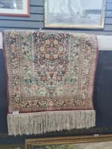 A small hand knitted part silk rug by The Shanghai Jin Xiu Carpet Factory 92x61.5cm