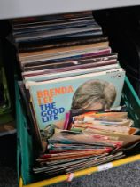 A box of old vinyl LPs and 7" singles