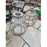 A pair of modern octagonal coach house lamps with wall mounted supports