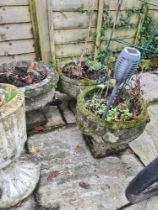 A pair of reconstituted garden pots on square feet and 3 others