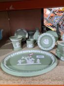A small quantity of green Wedgwood Jasperware items including vases and dishes