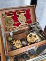 A small box of Military cap badges, belt buckles and sundry