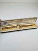 Rolex; a 9ct gold cased ladies Rolex with square champagne dial, numbered and baton dial, signed Rol