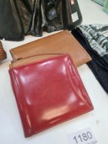 A vintage Loewe red leather wallet a Didier Lamarthe wallet and purse and one other