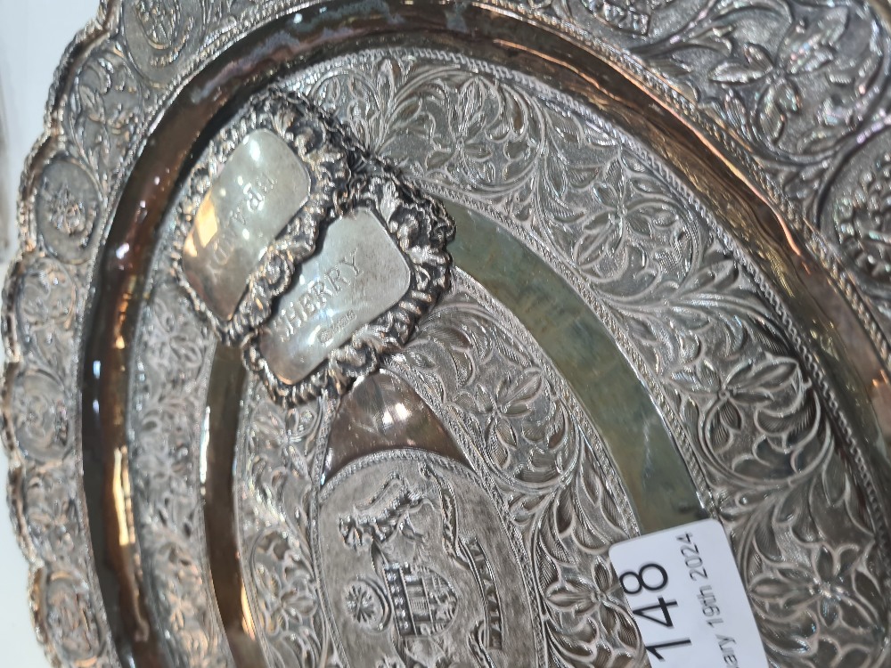 A white metal decorative tray having floral bordered pattern central motif enscribed 'Malaysia' and - Image 2 of 3