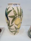 A modern Moorcroft vase decorated lemons and birds, 26cm (some crazing)