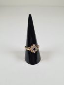 14ct yellow gold dress ring with tilted square shaped panel central square cut sapphire surrounded r