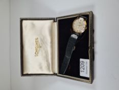 Longines; a 1960s 9ct gold cased Longines wristwatch, with champagne dial and baton markers, subsidi