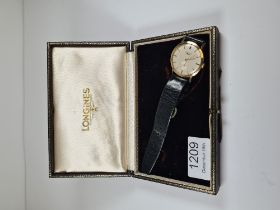 Longines; a 1960s 9ct gold cased Longines wristwatch, with champagne dial and baton markers, subsidi