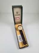 Rolex; A vintage gent's 'Rolex' watch with textured champagne dial baton and numbered markers marked