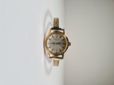Gold plated ladies Longines watch with Champagne dial and gold baton markers, on expanding plated st