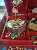 Red jewellery box containing various costume jewellery and watches, silver bracelet, brooches, rings