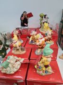 A set of Royal Doulton Disney Showcase figures of snow White and the 7 Dwarfs and an additional figu