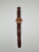 Vintage 9ct gold cased Accurist watch with copper and golden dial Roman numerals and subsidiary seco