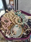Tub of mixed costume jewellery include amethyst necklace, simulated pearls, bead necklaces, etc and