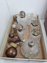 A quantity of perfume bottles, ink wells and similar, some with silver lids, and other sundry items