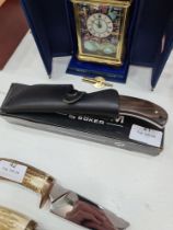 A Magnum gut hook knife by Boker, with wooden handle and leather case
