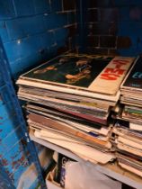 A large quantity of vinyl LP records and 7 inch singles, mixed genres and decades