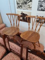 A pair of vintage Ercol candlestick design kitchen chairs