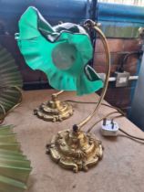 A pair of brass plated desk lamps having green glass shades