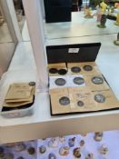 A quantity of old British coins to include hammered examples, Shillings, Crowns and similar. Some of