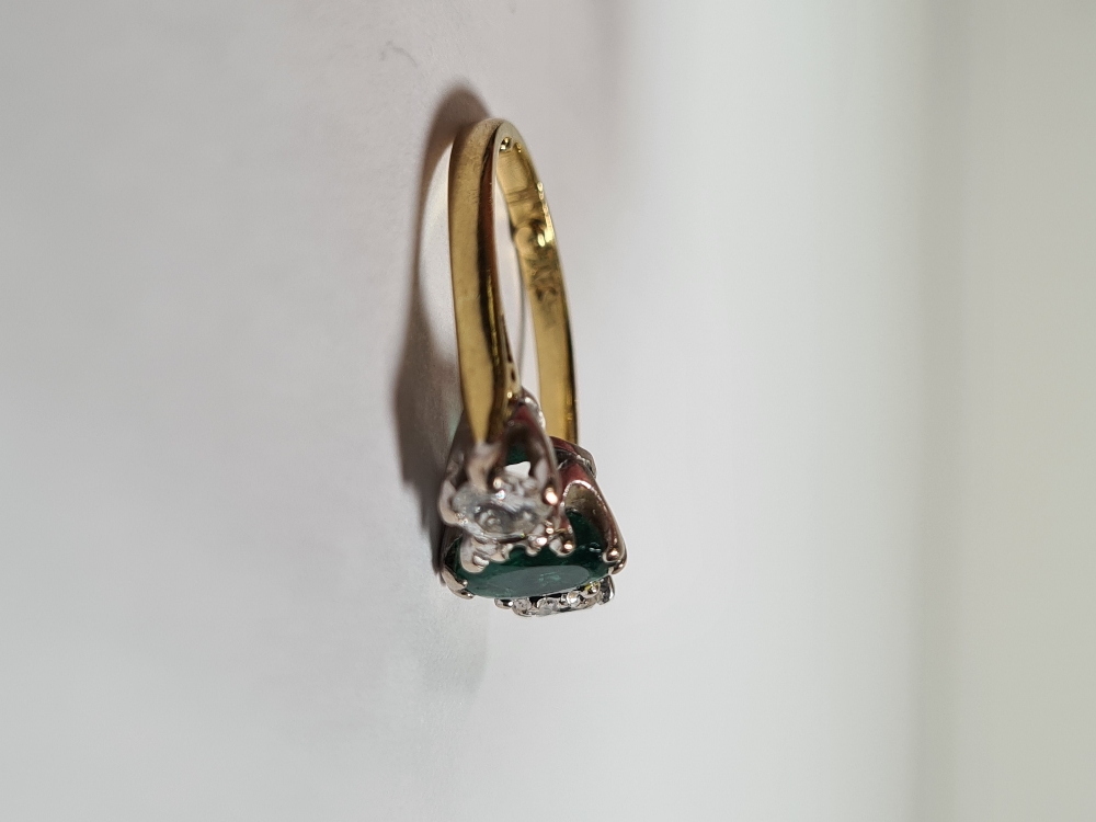 18ct yellow gold emerald and diamond trilogy ring, with central oval mixed cut emerald with a brilli - Image 4 of 12