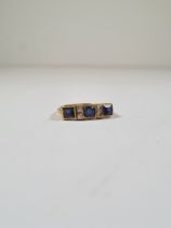 18ct yellow gold sapphire and diamond half hoop ring set central cushion cut blue sapphire flanked s
