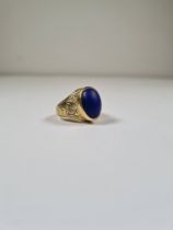 18ct yellow gold Signet ring with central cabouchon oval Lapis panel, rubover set with engraved flor