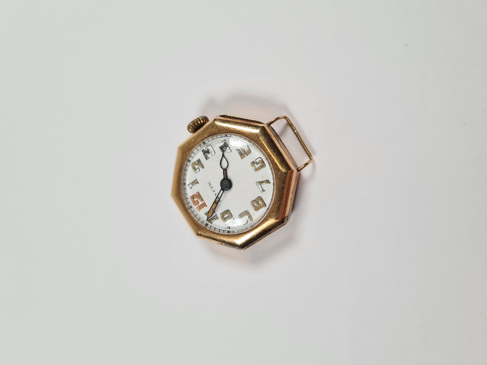 14K gold cased watch head, with circular enamelled numbered dial in octagonal 14K gold cased dial si