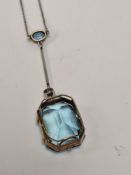 Unmarked white metal neckchain, hung with an aquamarine and diamond pendant, comprising oval cut rub