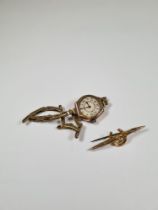 9ct yellow gold bar brooch with applied horseshoe decoration, AF, 9ct gold cased antique watch on pl