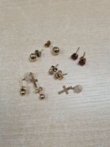 Collection of 9ct and other gold stud earrings,