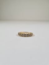 18ct yellow gold half eternity ring set, set with 7 round cut diamonds, marked 750, size Q, approx 3