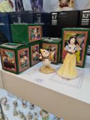 A Royal Doulton set of Snow White and The Seven Dwarfs, No 1002 of 2000, with certificate, boxed