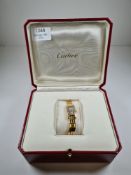 Cartier; A ladies 18ct yellow gold Tank Allongee Lanieres wristwatch, with silvered textured rectang