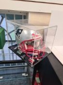 A Tristar Productions full size American Football Helmet signed by Tom Brady in Patriot colours, wit