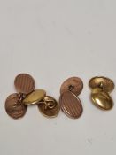 Two pairs of oval 9ct gold cufflinks, one of plain oval design, and the others 9ct rose gold oval wi