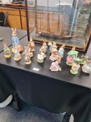 17 Royal Albert Beatrix Potter figures to include a large figure of Peter Rabbit with red handkerchi