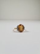 18ct yellow gold dress ring, with large oval central citrine, each side flanked 5 graduating brillia