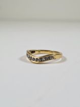 18ct yellow gold band ring set 9 small brilliant round cut diamonds in curved mount, approx 0.25 car