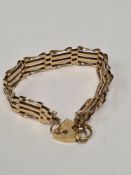 9ct yellow gold 4 bar gatelink bracelet with heart shaped clasp and safety chain, AF one link damage
