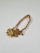 Yellow gold Egyptian, bracelet with tapered links leading to three Egyptian Cartouche panels, Arabic