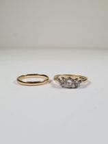 9ct yellow gold wedding band, marked 375, size Q, and a 9 carat trilogy paste set ring, size P, appr