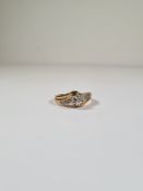 9ct yellow gold dress ring, with raised 6 claw illusion set diamond on cross over designed shoulders